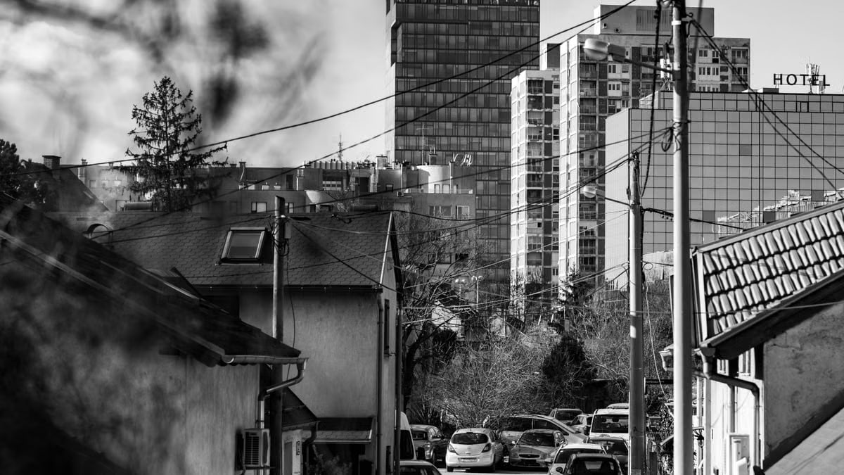 Black and white urban landscape showcasing skylines and residential area in Zagreb.